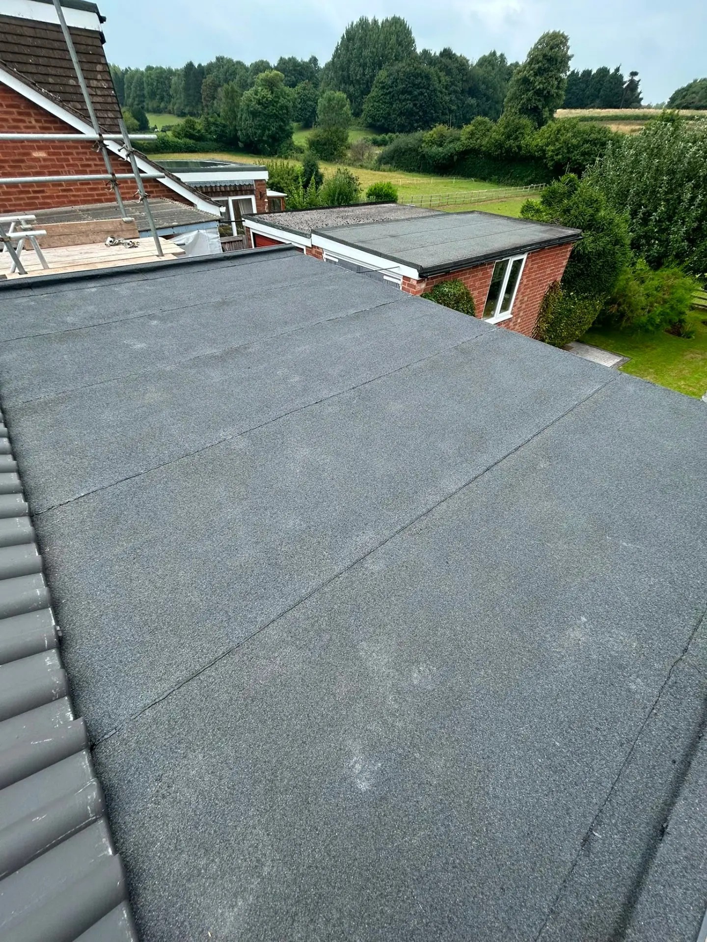 Flat roof replacement, new torch-on felt system